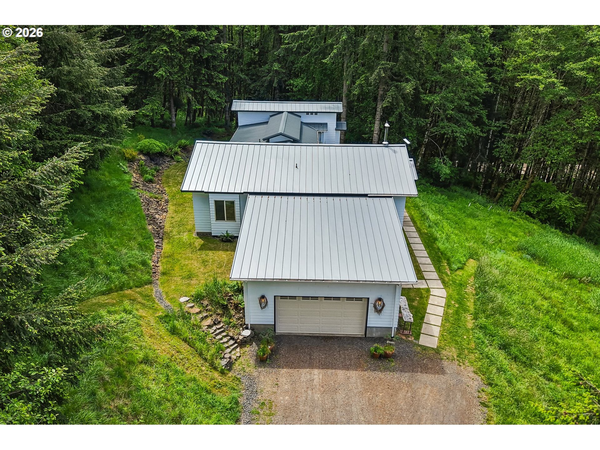 873 Mountain View Road Kalama, WA 98625 - Photo 38 of 45 a view of a wooden house and a yard