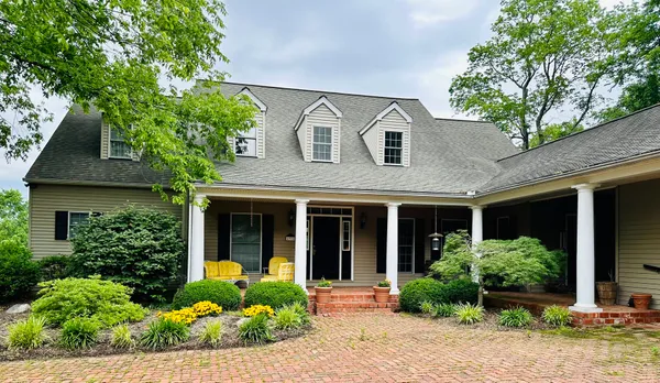 a view of a house with a snow in a yard
