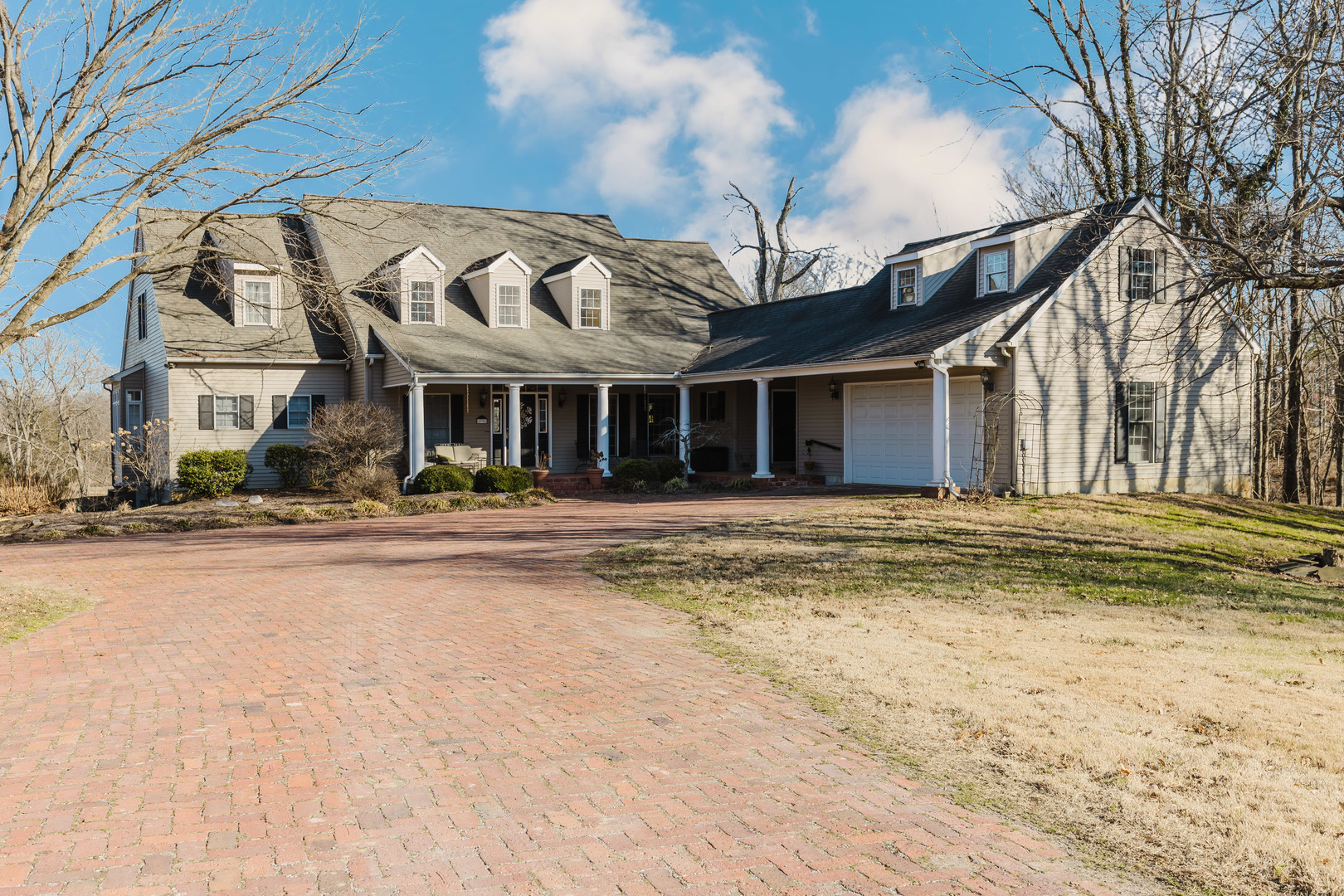 4996 Andrew Road Marion, IL 62959 - Photo 3 of 85 a front view of a house with a yard covered with snow and trees