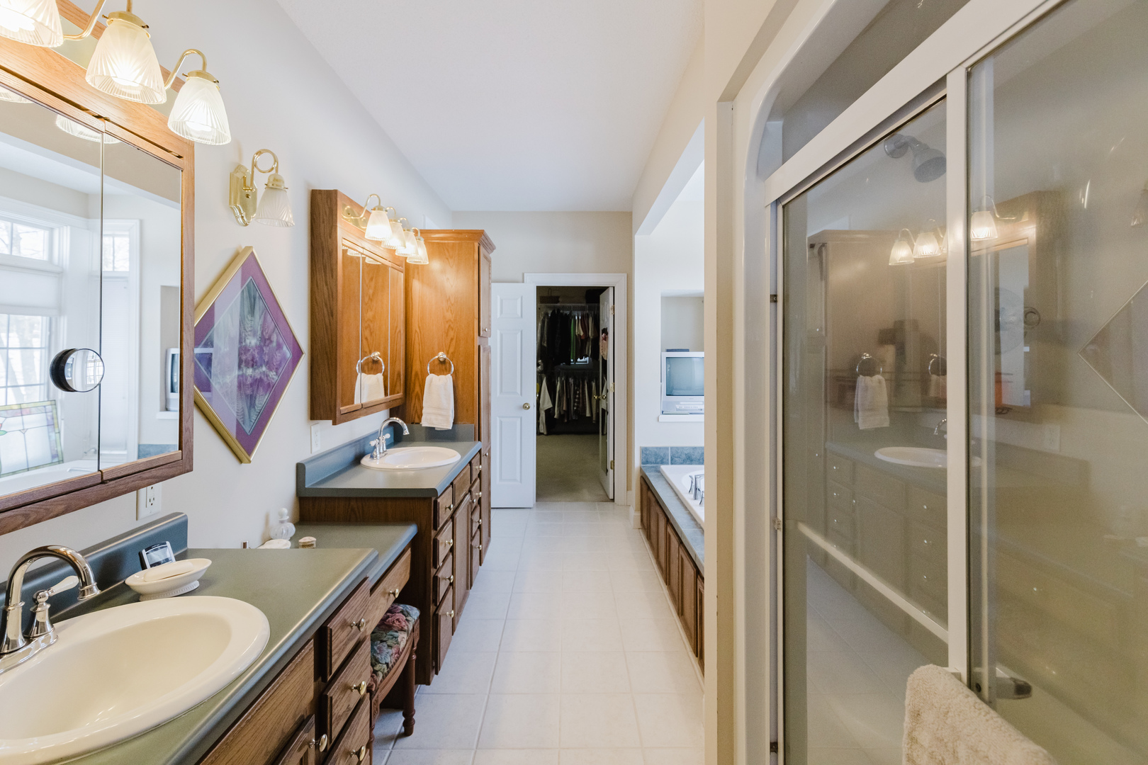 4996 Andrew Road Marion, IL 62959 - Photo 38 of 85 a bathroom with a granite countertop sink a mirror a vanity and shower