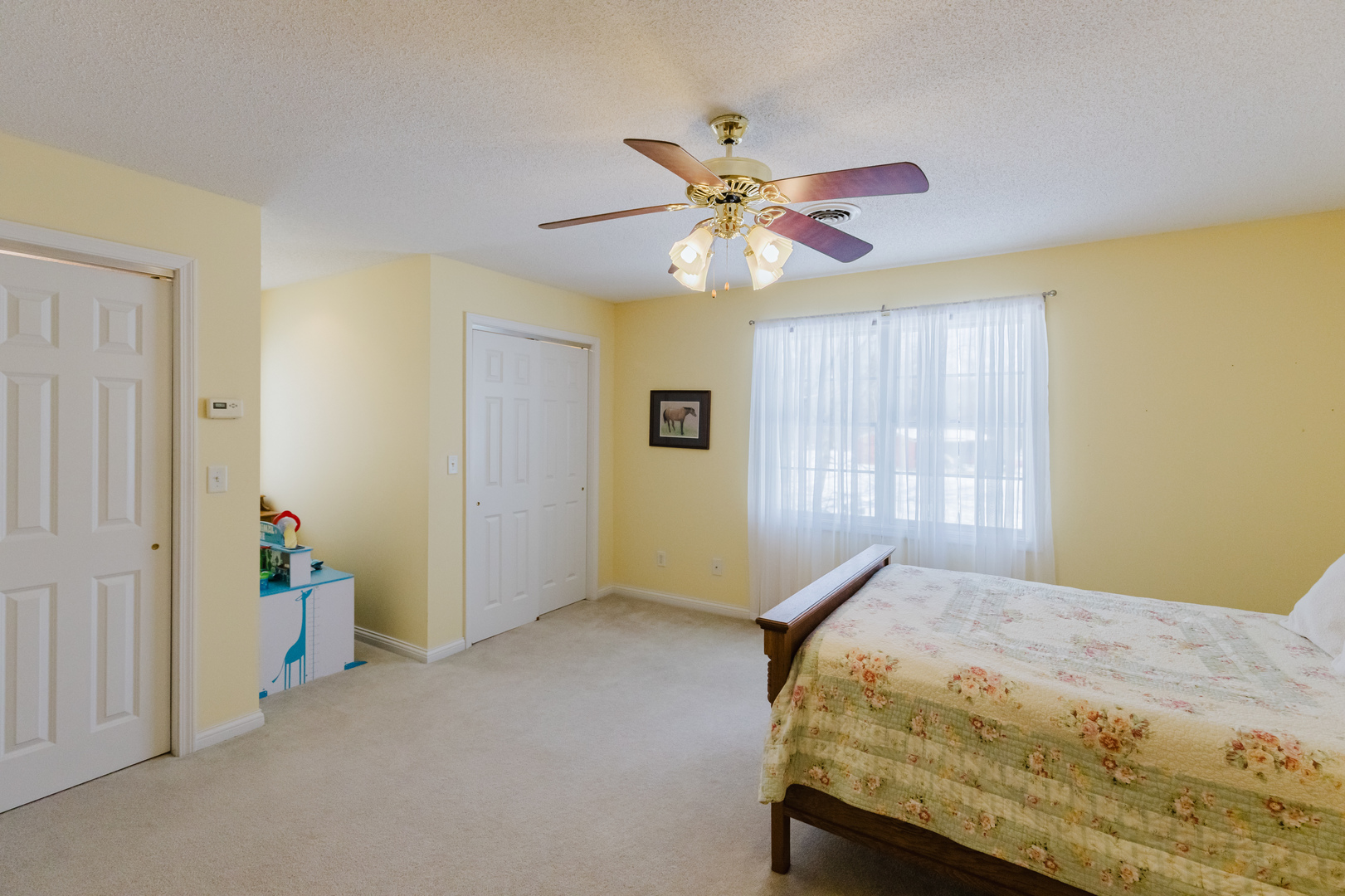 4996 Andrew Road Marion, IL 62959 - Photo 42 of 85 a bedroom with a bed and a chandelier