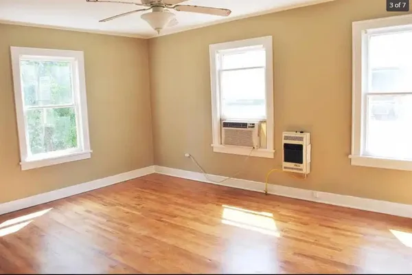 a view of an empty room with a window