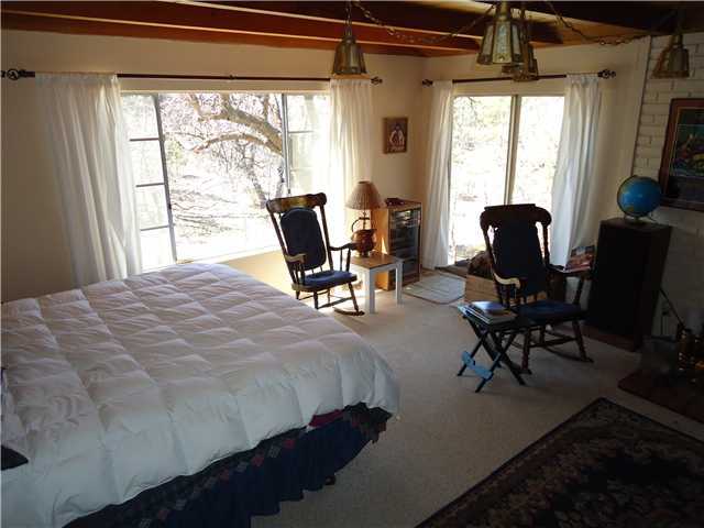 797 Boiling Springs Road Mount Laguna, CA 91948 - Photo 11 of 19 This is the livingroom but sellers liked the view so put the bed down here. There are 2 bedrrom upstairs.