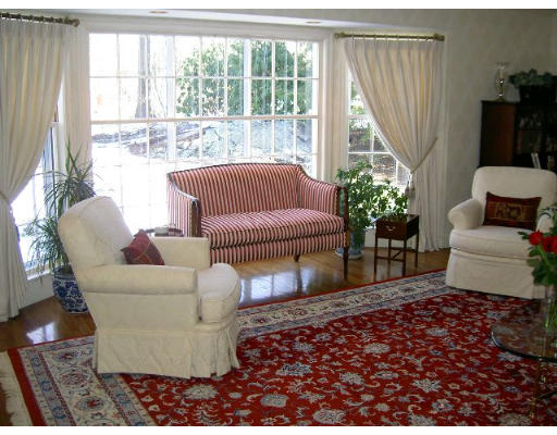 28 Norwich Road Wellesley, MA 02481 - Photo 2 of 14 a living room with furniture and a large window