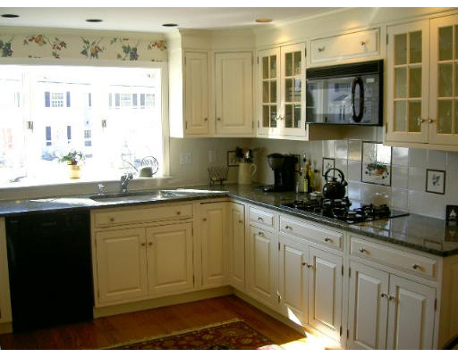 28 Norwich Road Wellesley, MA 02481 - Photo 7 of 14 a kitchen with stainless steel appliances granite countertop a sink stove and cabinets