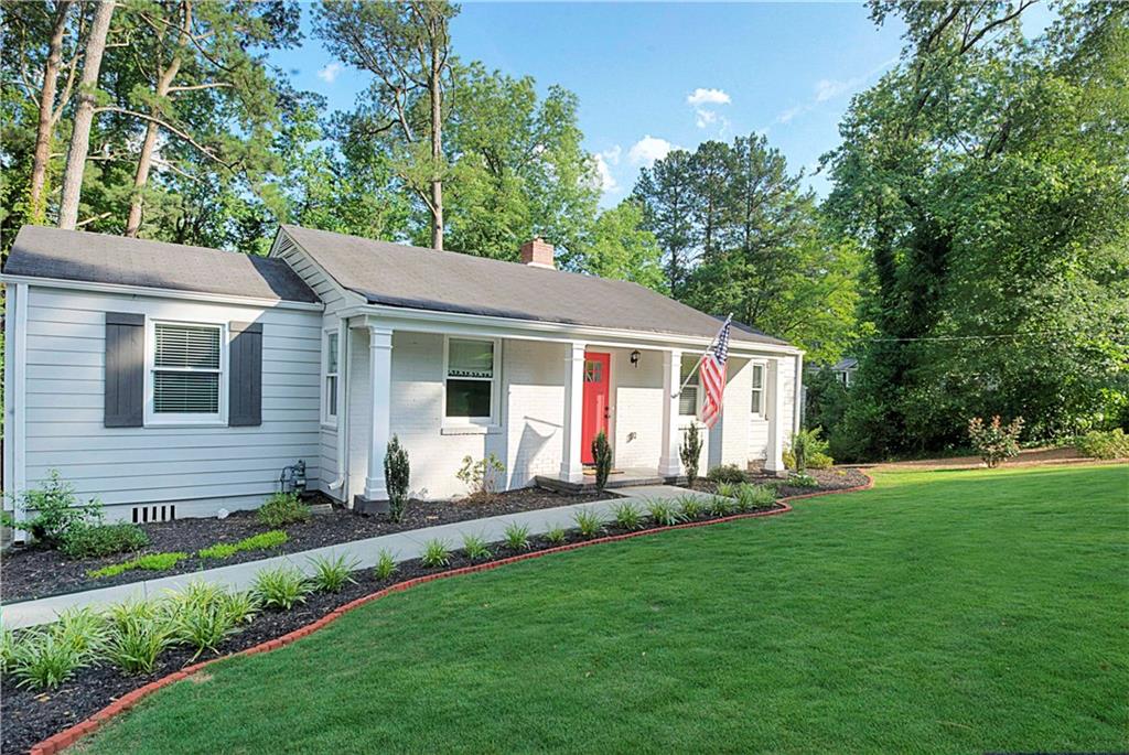 1815 Hickory Road Atlanta, GA 30341 - Photo 1 of 1 Pristine professional landscaping & new manicured lawn welcomes outdoor living.
