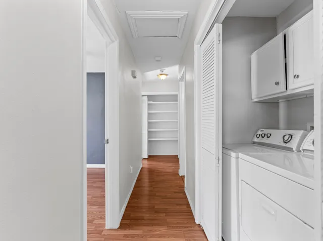 a view of hallway with washer and dryer