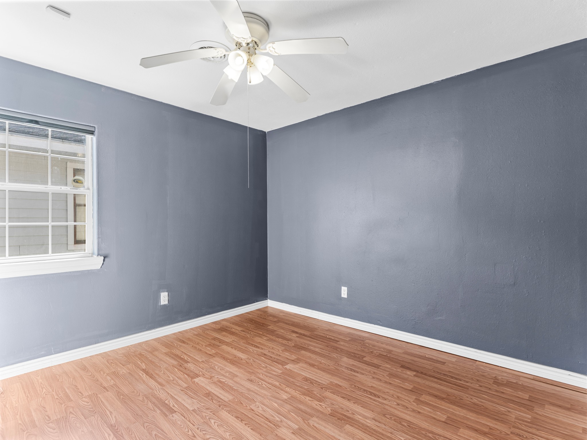 219 Beecher Avenue Palacios, TX 77465 - Photo 14 of 23 a view of empty room with wooden floor