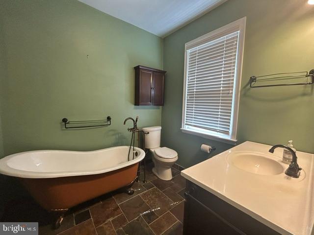 306 Kingston Road Baltimore, MD 21229 - Photo 15 of 17 a bathroom with a sink and mirror
