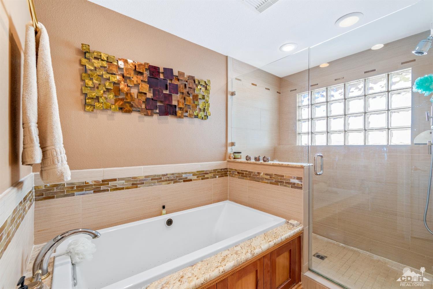 68420 Risueno Road Cathedral City, CA 92234 - Photo 20 of 37 a bathroom with a tub sink and mirror