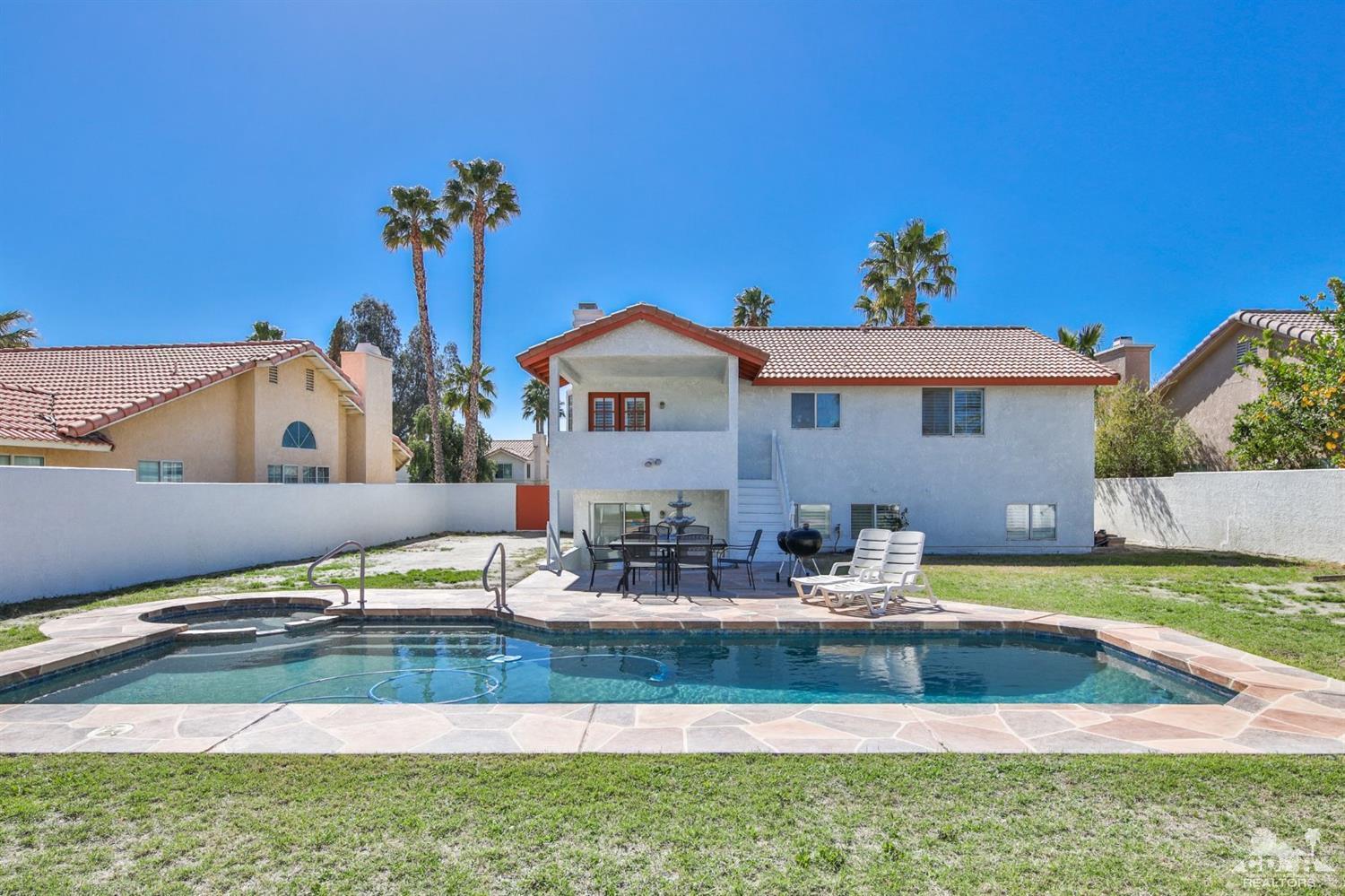 68420 Risueno Road Cathedral City, CA 92234 - Photo 3 of 37 a view of a house with pool and chairs
