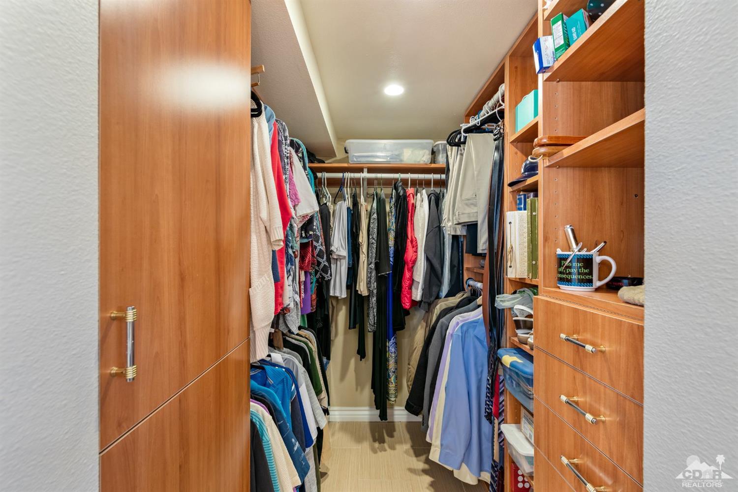 68420 Risueno Road Cathedral City, CA 92234 - Photo 21 of 37 a view of walk in closet with clothes