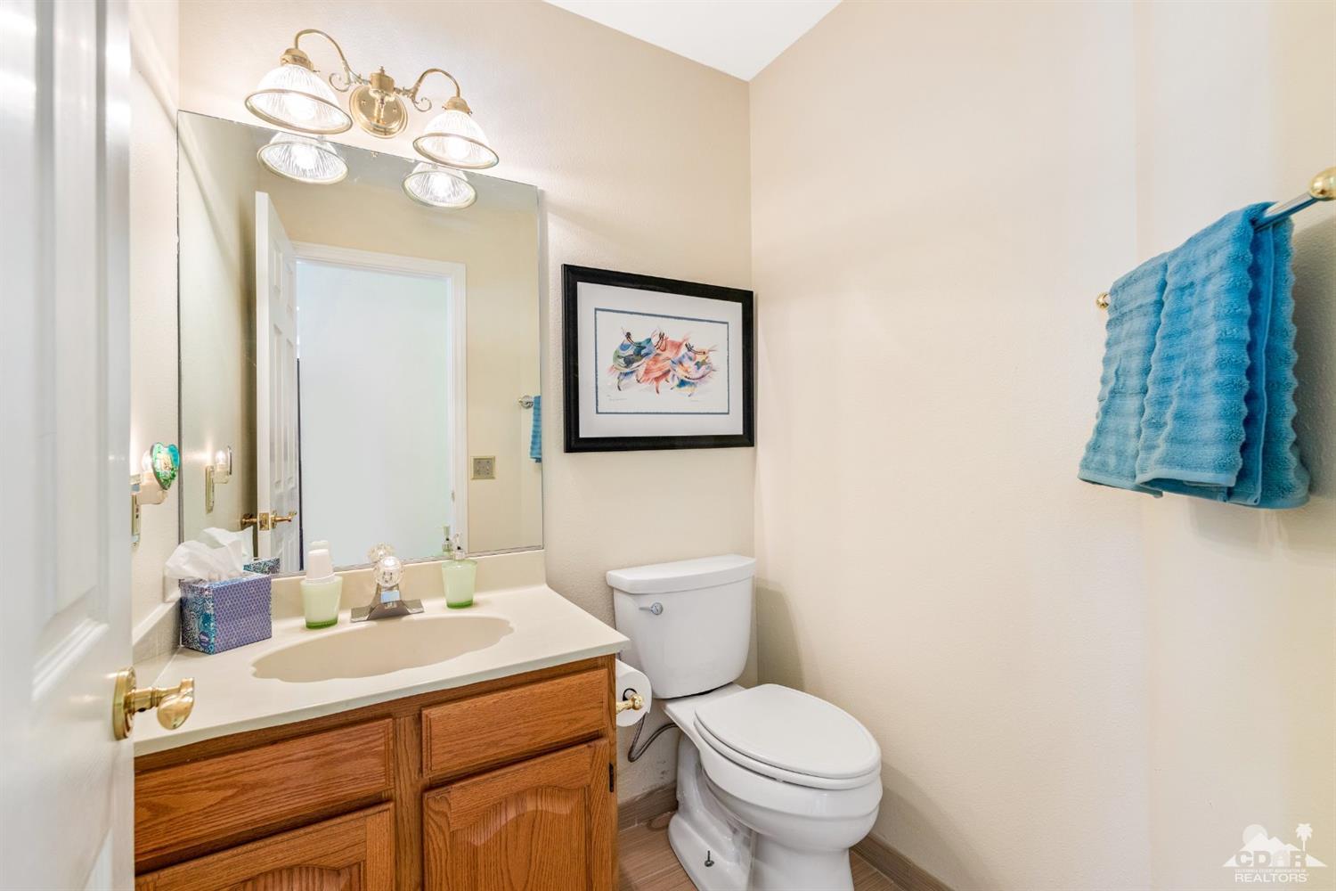 68420 Risueno Road Cathedral City, CA 92234 - Photo 29 of 37 a bathroom with a sink vanity mirror and toilet