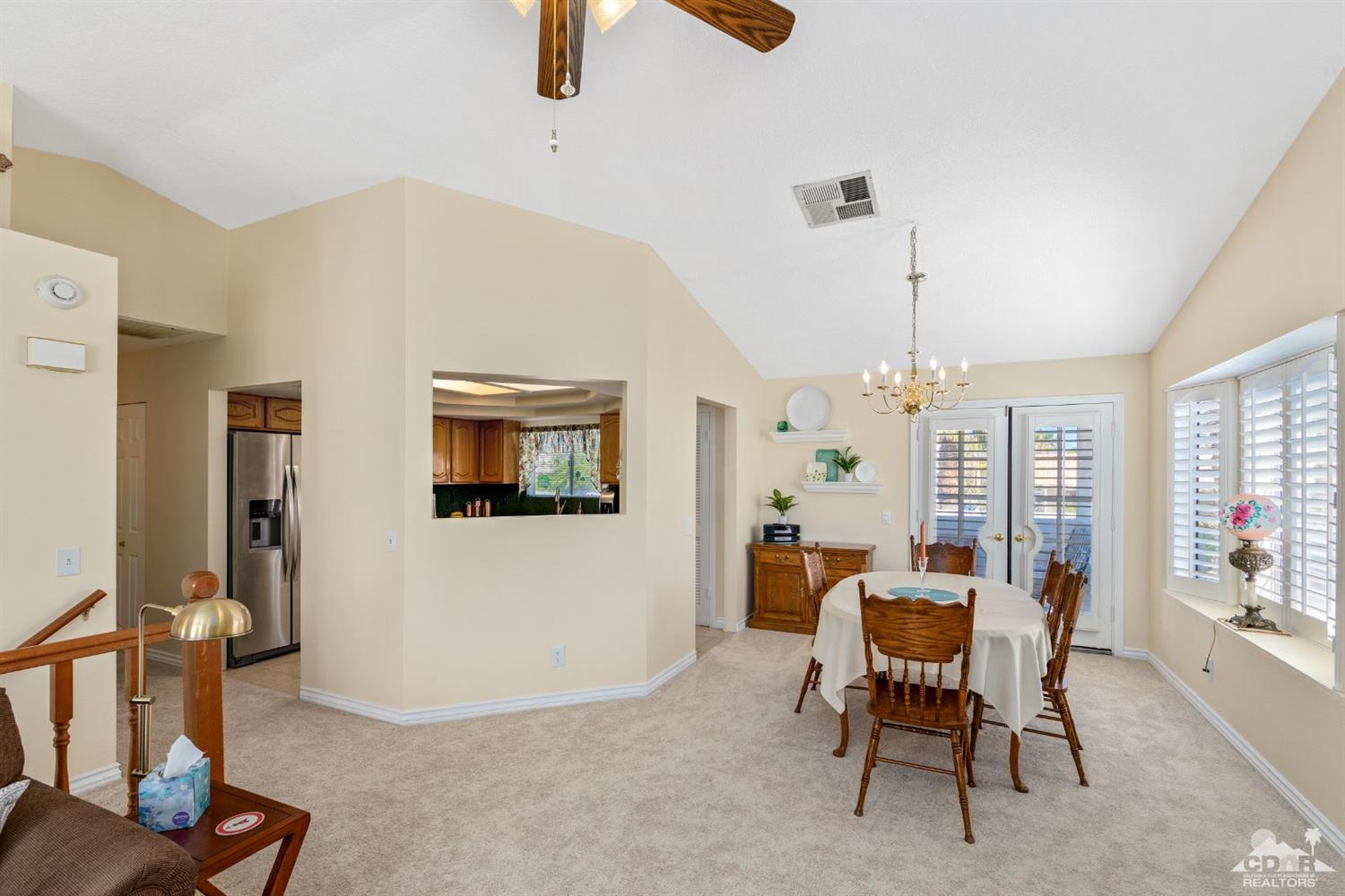 68420 Risueno Road Cathedral City, CA 92234 - Photo 7 of 37 a view of a livingroom with furniture and window