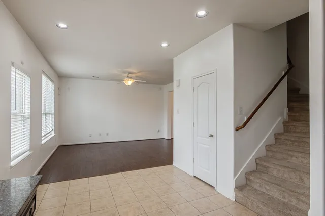 a view of entryway with wooden floor and stairs