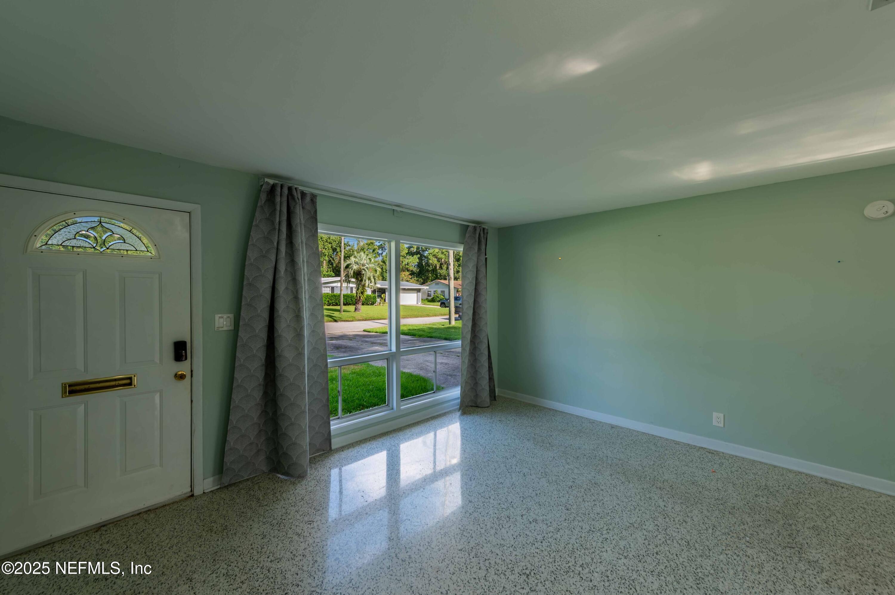 723 Montego Road West Jacksonville, FL 32216 - Photo 12 of 34 2025_08_18 723 Montego Rd W-34-living ro