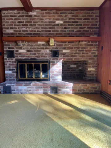 a view of a room with a large window