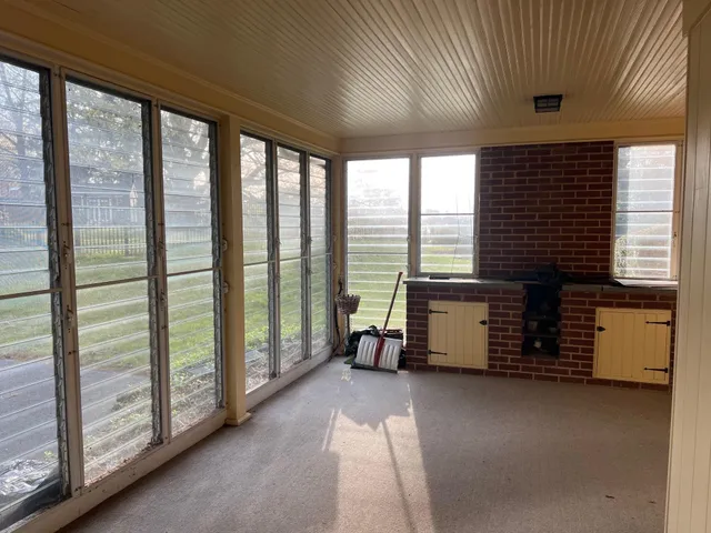 a view of a door and a window