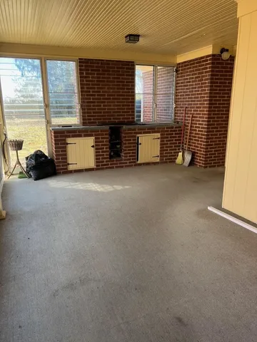 a kitchen with a sink cabinets and window