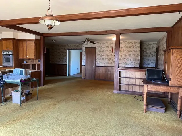 a kitchen with lots of counter top space and appliances