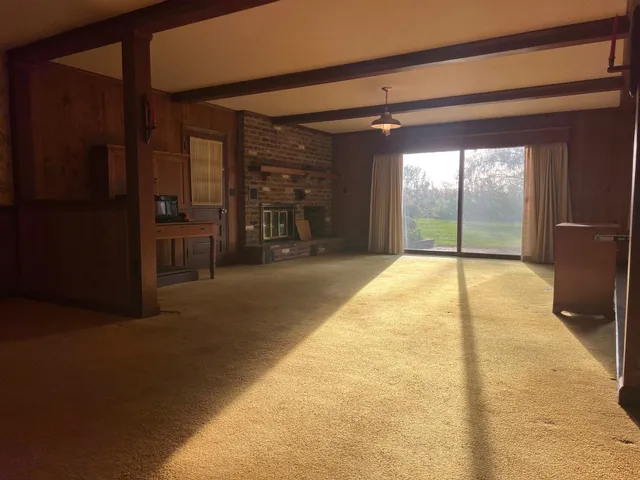 a kitchen with stove and cabinets