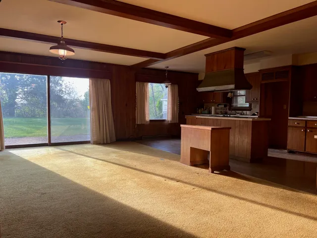 a view of a livingroom with furniture and a fireplace