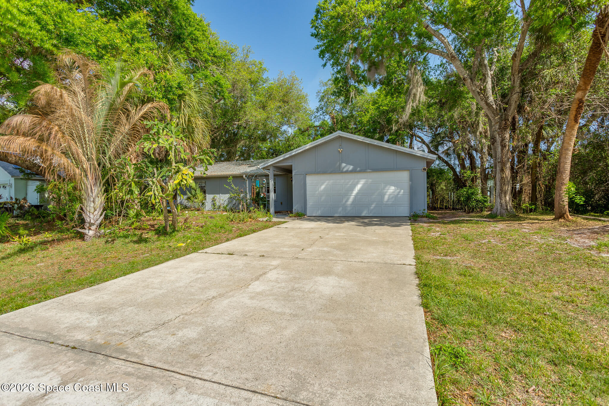 2255 Ladner Road Northeast Palm Bay, FL 32907 - Photo 1 of 22 a front view of a house with a yard