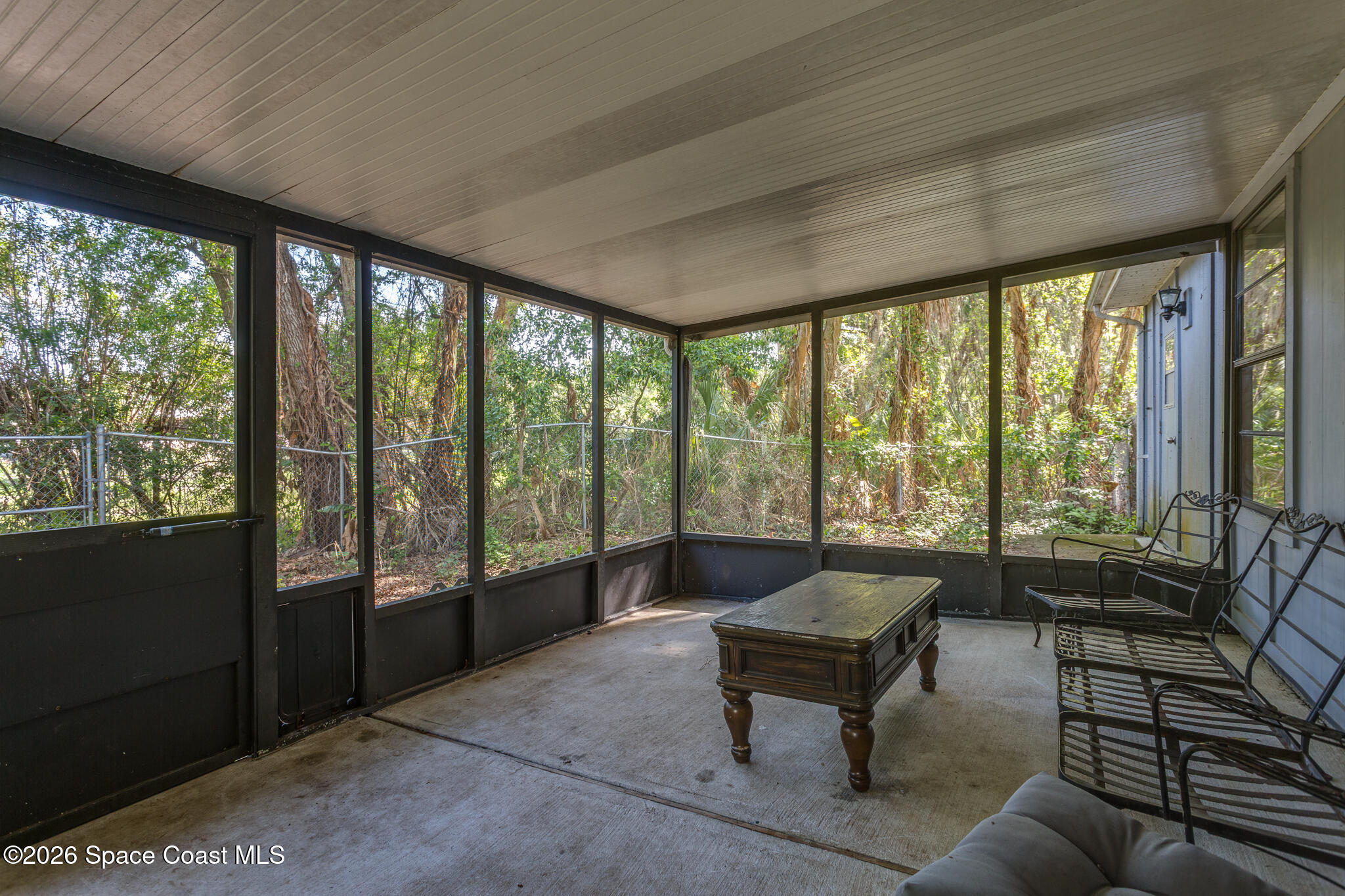 2255 Ladner Road Northeast Palm Bay, FL 32907 - Photo 15 of 22 a living room with furniture and windows