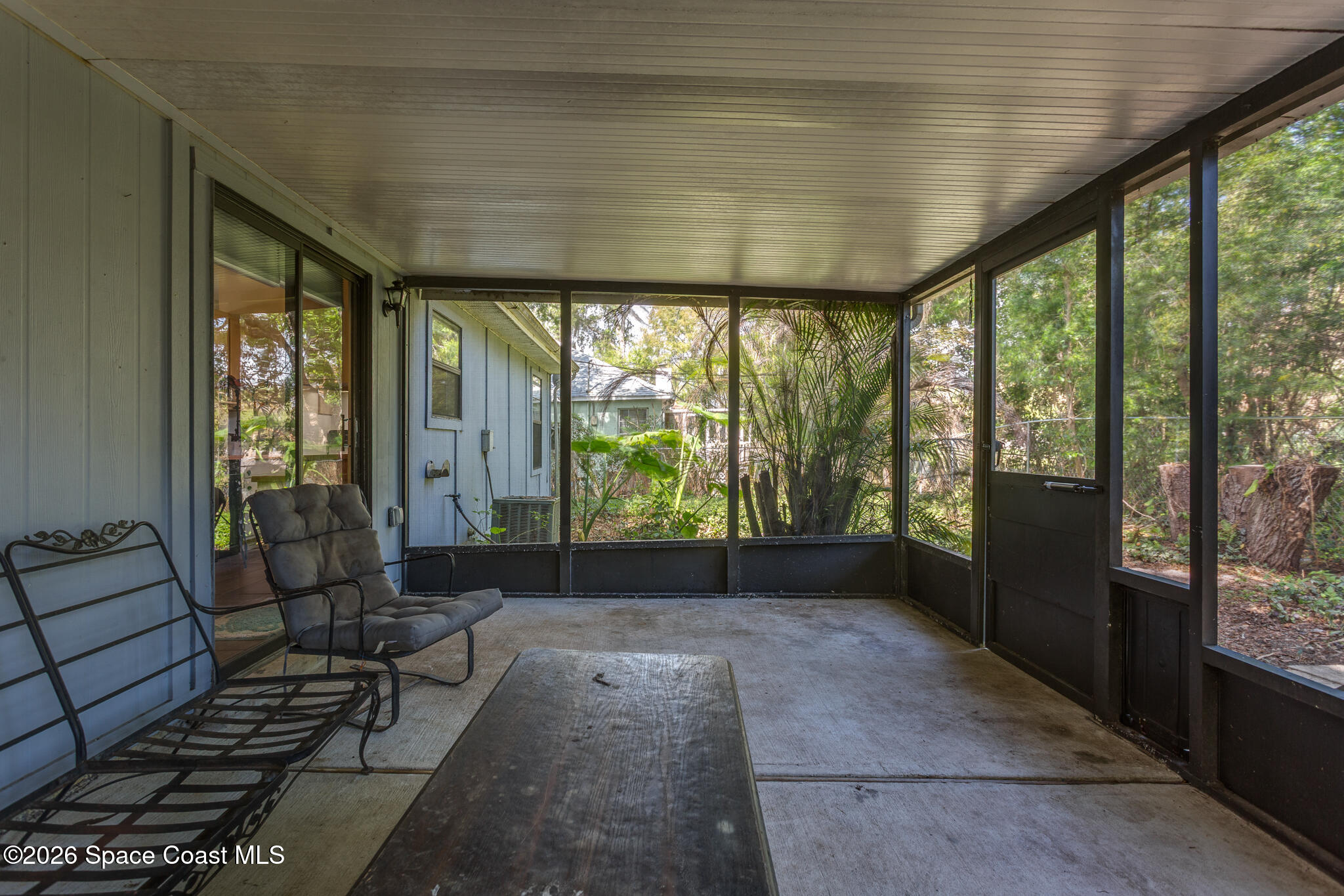 2255 Ladner Road Northeast Palm Bay, FL 32907 - Photo 16 of 22 a living room with large windows