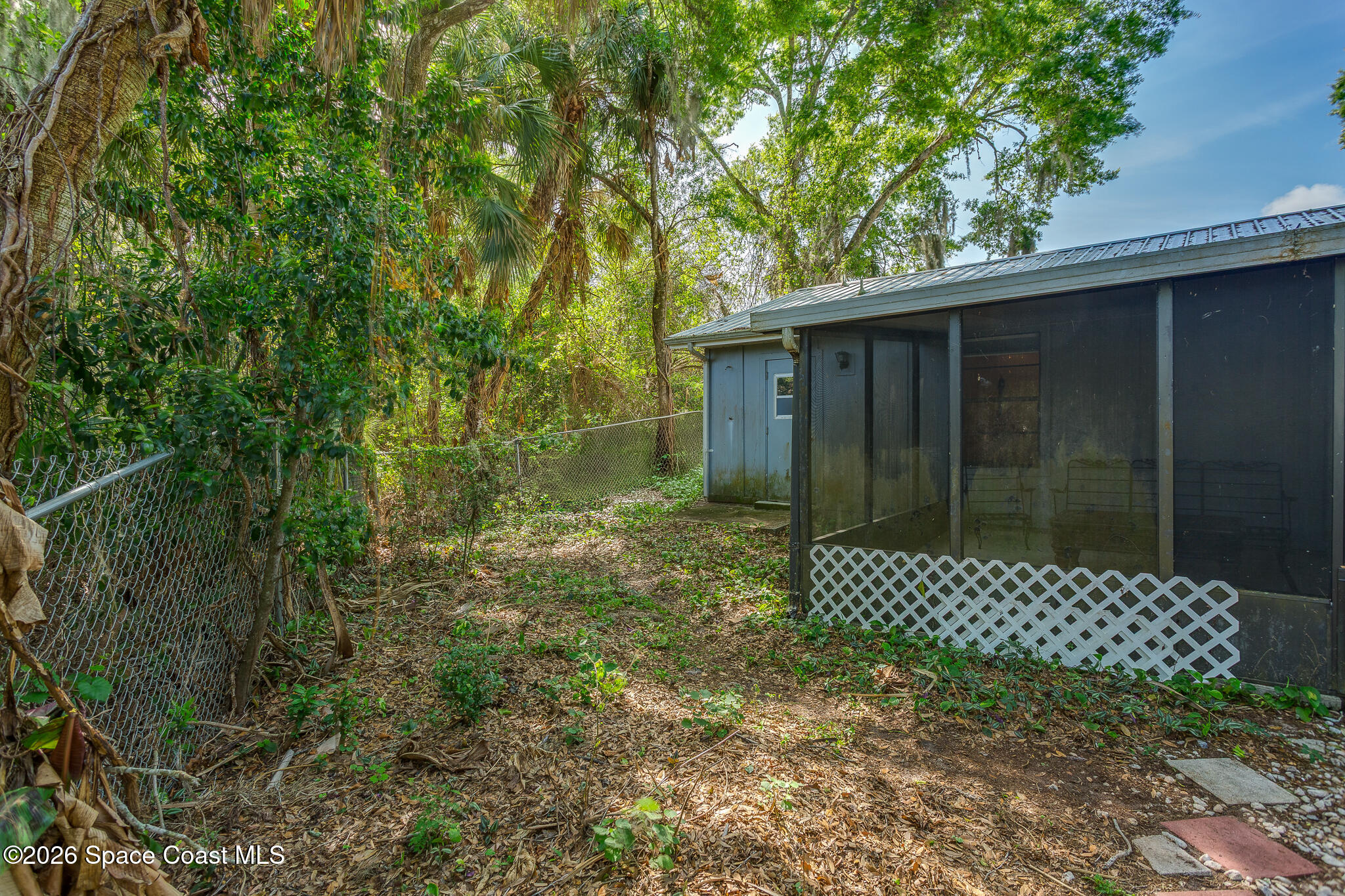 2255 Ladner Road Northeast Palm Bay, FL 32907 - Photo 17 of 22 a back yard of a house