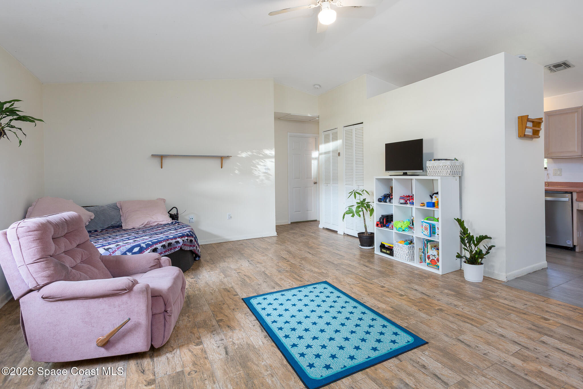 2255 Ladner Road Northeast Palm Bay, FL 32907 - Photo 5 of 22 a room with furniture and a flat screen tv