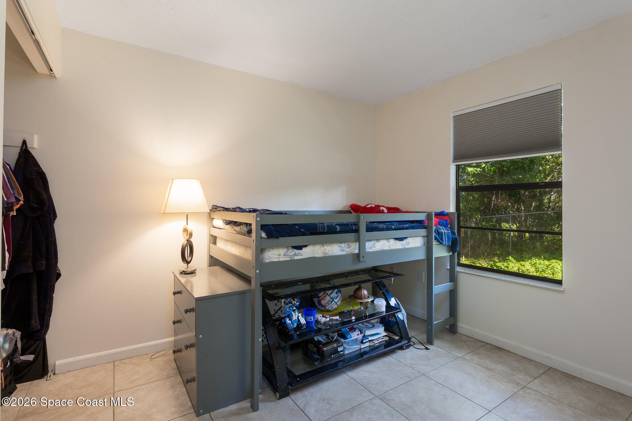 2255 Ladner Road Northeast Palm Bay, FL 32907 - Photo 9 of 22 a room with storage and a fireplace