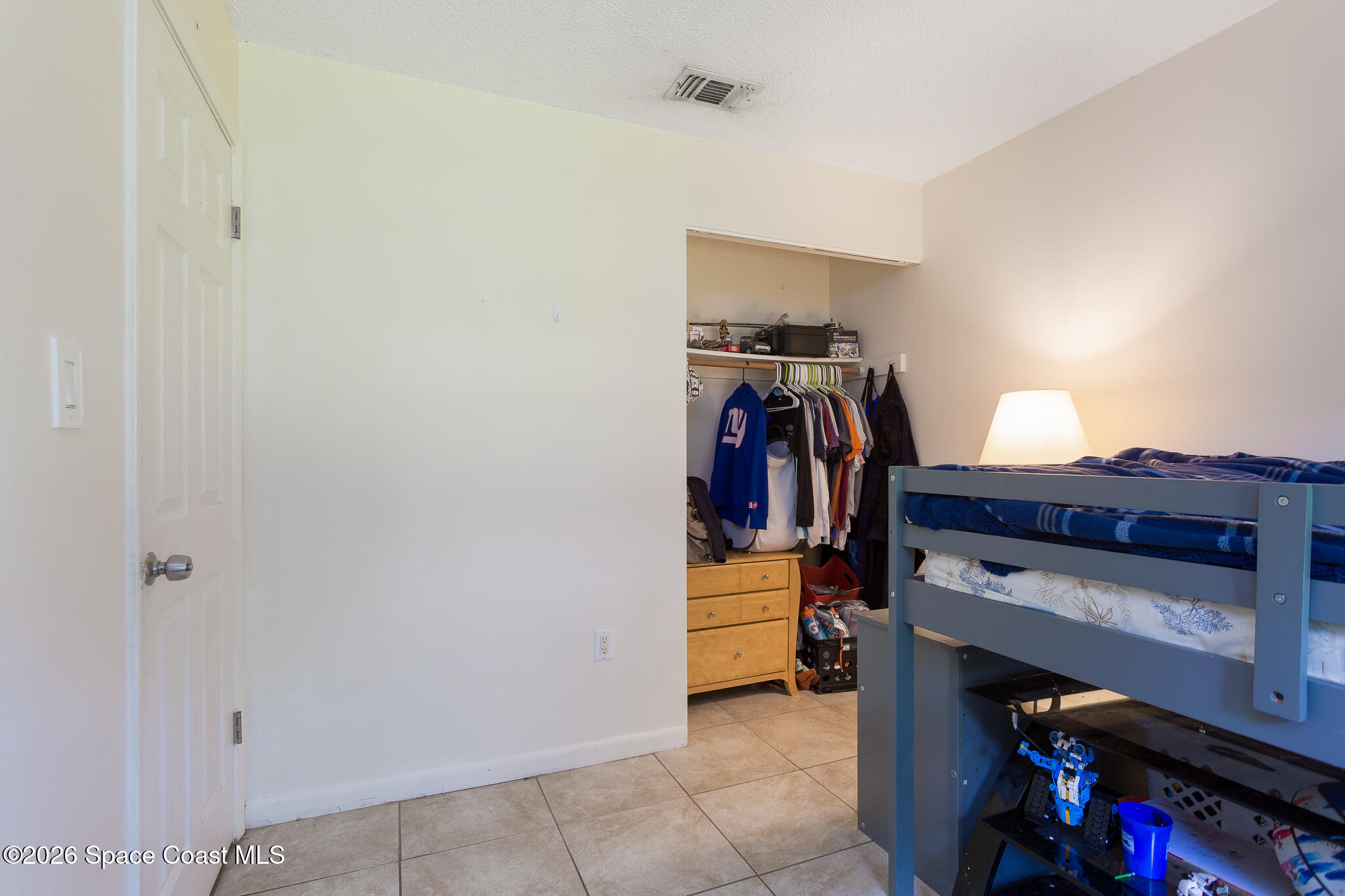 2255 Ladner Road Northeast Palm Bay, FL 32907 - Photo 10 of 22 a view of walk in closet with clothes and shoes