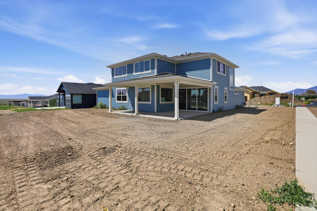 1315 West 3200 South, Unit 17 Perry, UT 84302 - Photo 54 of 58 Two-story residence featuring blue siding and white trim