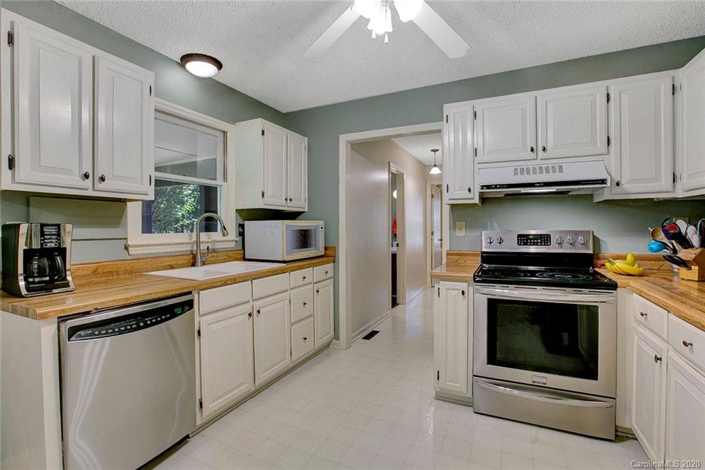 220 South Mccoy Road Salisbury, NC 28144 - Photo 3 of 46 a kitchen with stainless steel appliances granite countertop a stove sink and cabinets