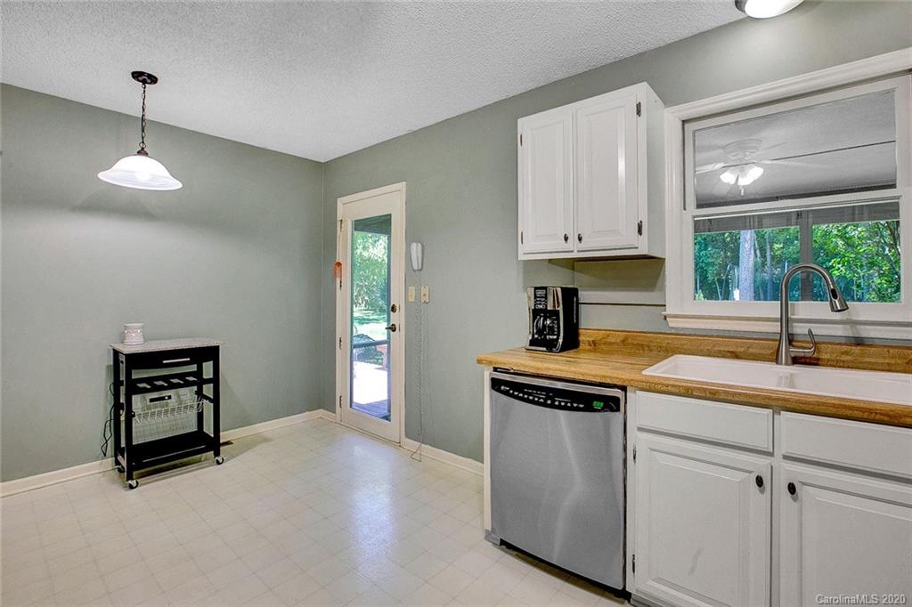 220 South Mccoy Road Salisbury, NC 28144 - Photo 5 of 46 a kitchen with stainless steel appliances granite countertop a sink a stove and a window