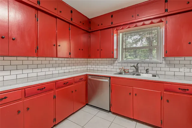 an empty room with furniture and window
