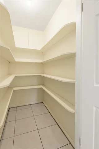 a bathroom with a toilet a sink a mirror and a shower