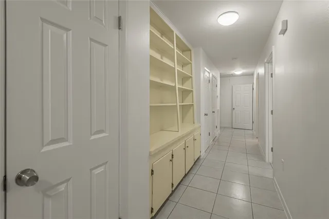 a bathroom with a shower and a sink