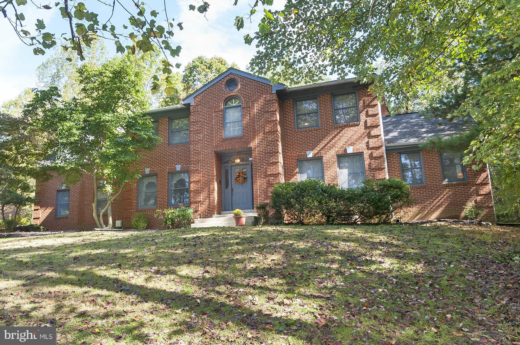 14903 Peach Orchard Road Silver Spring, MD 20905 - Photo 1 of 30 a front view of a house with a yard