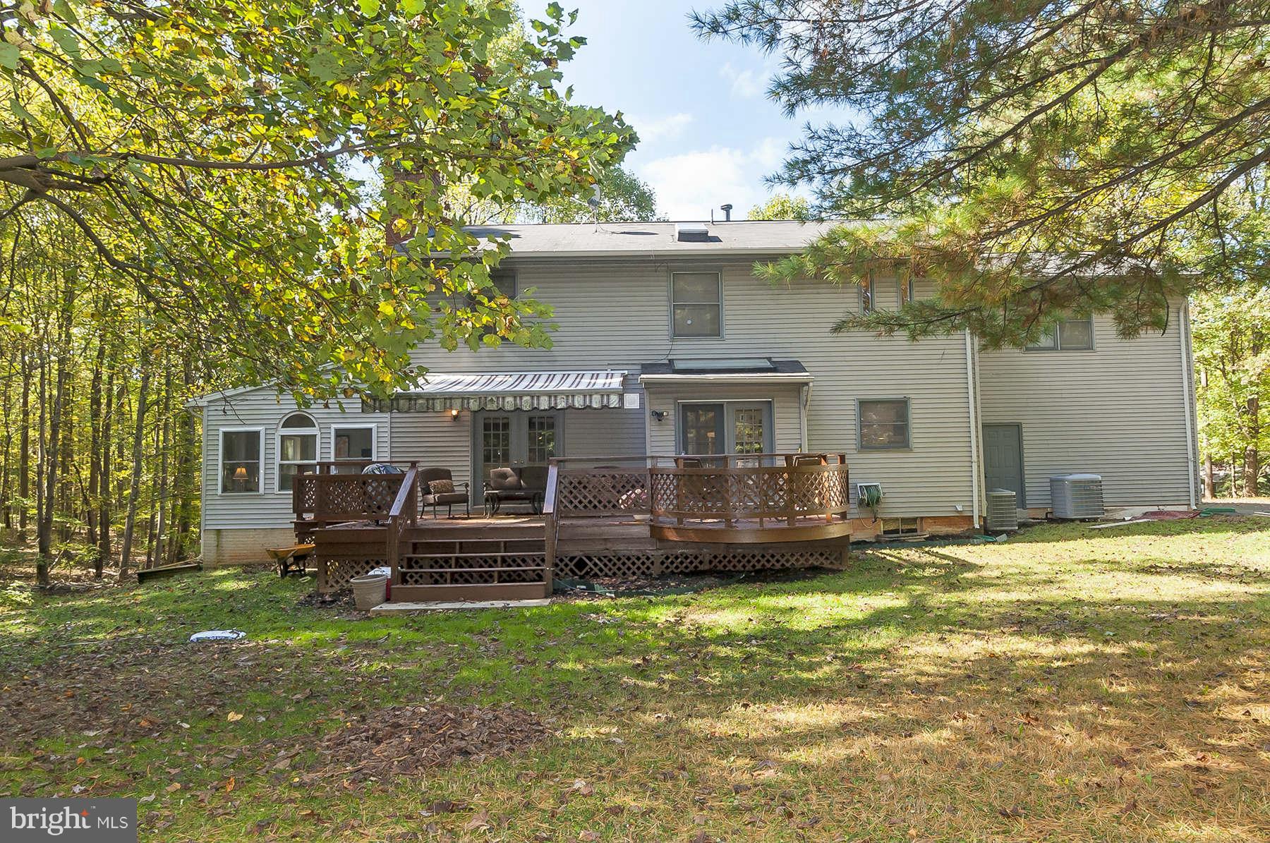 14903 Peach Orchard Road Silver Spring, MD 20905 - Photo 29 of 30 a front view of a house with a garden