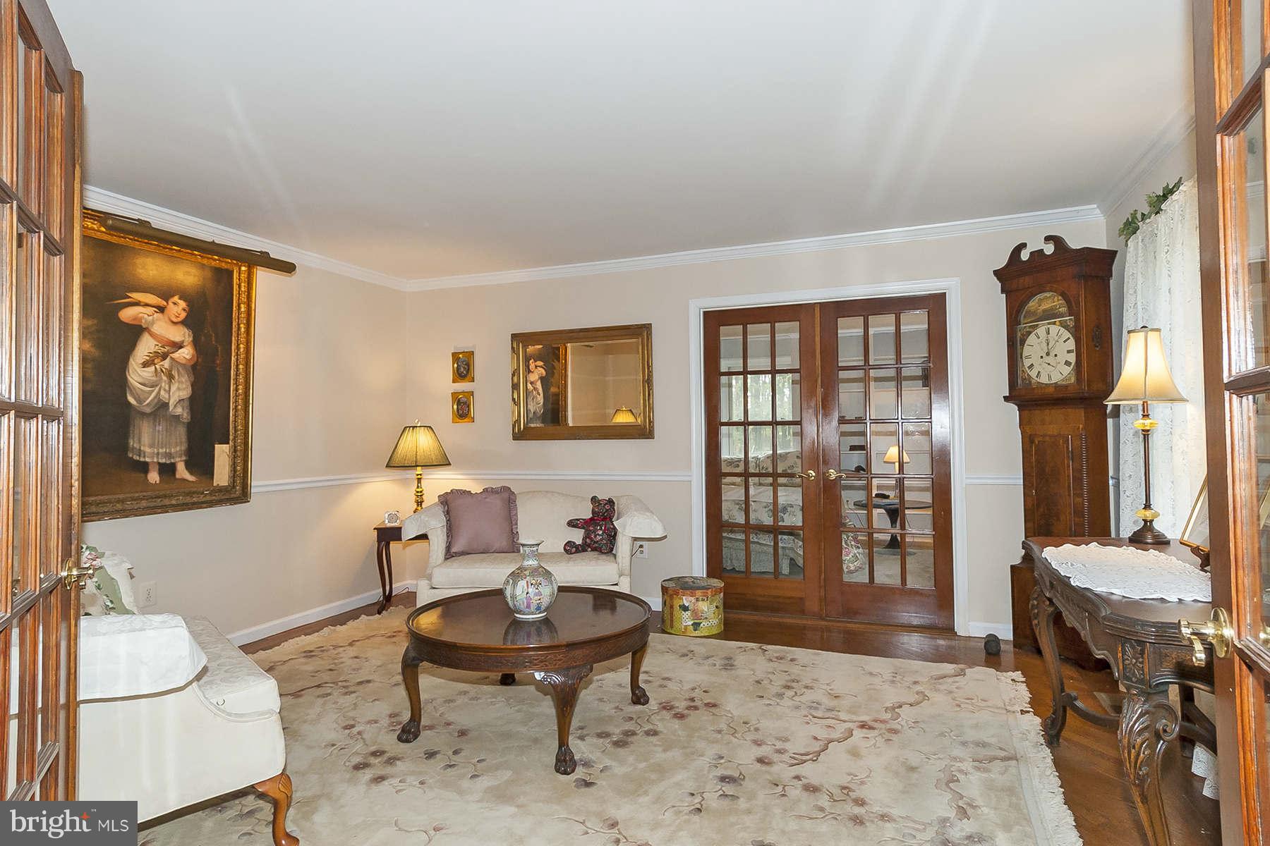 14903 Peach Orchard Road Silver Spring, MD 20905 - Photo 4 of 30 a living room with furniture and a window
