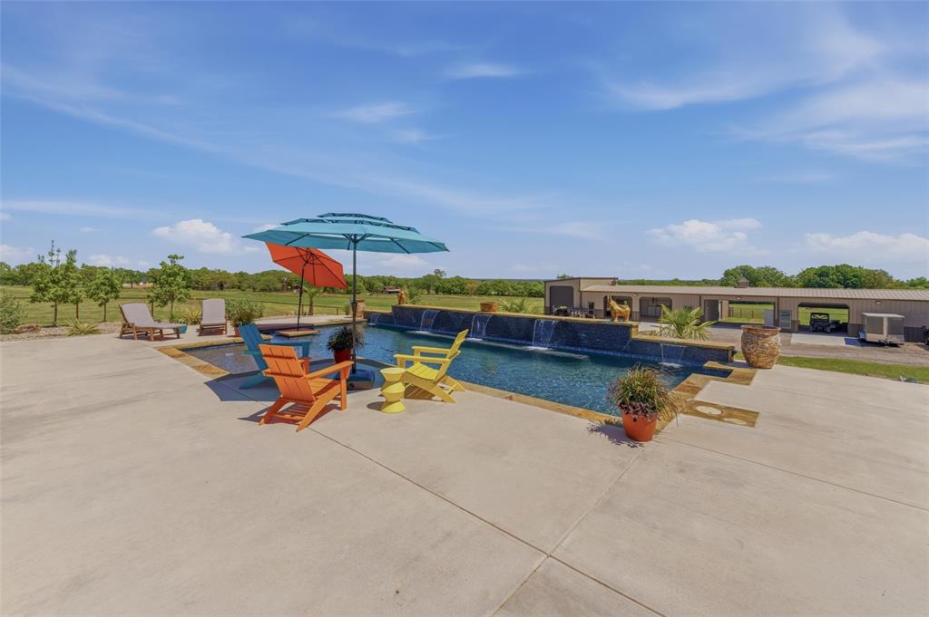 10106 Prather Road Springtown, TX 76082 - Photo 6 of 40 an outdoor space with pool and furniture