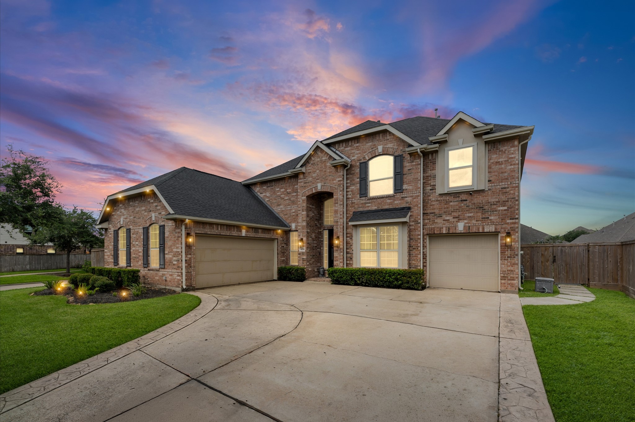 14016 Savannah Landing Lane Rosharon, TX 77583 - Photo 2 of 49 a front view of a house with a yard and garage