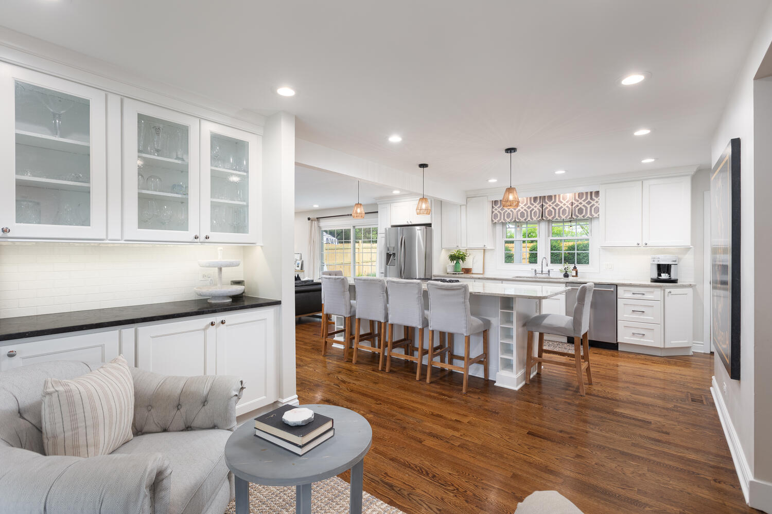 2S151 Stratford Road Glen Ellyn, IL 60137 - Photo 11 of 48 a kitchen with stainless steel appliances kitchen island granite countertop a table chairs sink and cabinets