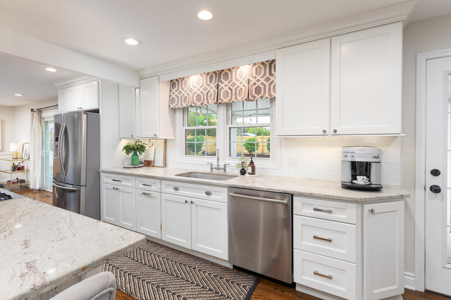 2S151 Stratford Road Glen Ellyn, IL 60137 - Photo 13 of 48 a kitchen with granite countertop white cabinets white appliances a sink and a window