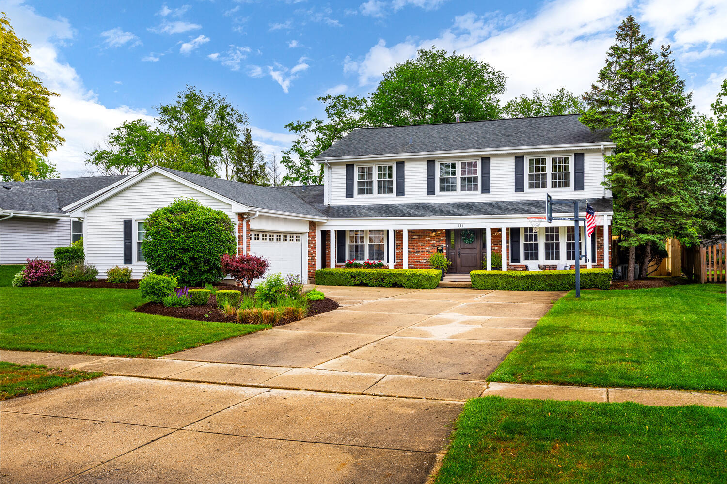 2S151 Stratford Road Glen Ellyn, IL 60137 - Photo 2 of 48 a front view of a house with a yard