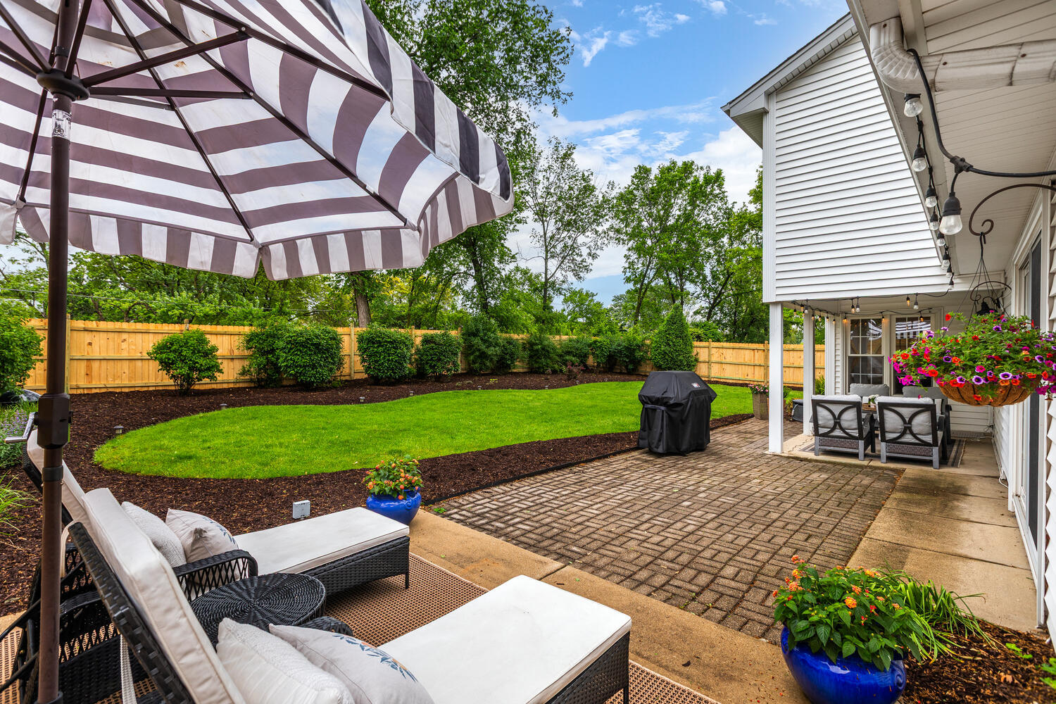 2S151 Stratford Road Glen Ellyn, IL 60137 - Photo 6 of 48 a view of a chairs and table in backyard of the house