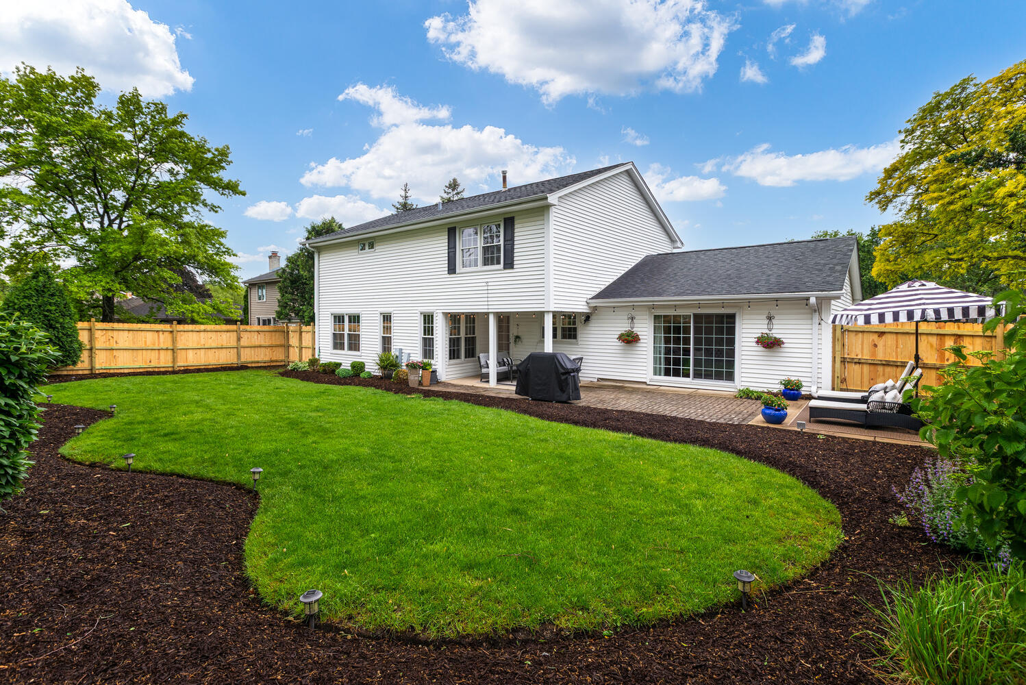 2S151 Stratford Road Glen Ellyn, IL 60137 - Photo 7 of 48 a front view of a house with a yard table and chairs