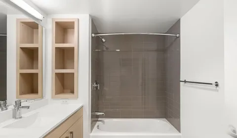 a bathroom with a bathtub and a sink